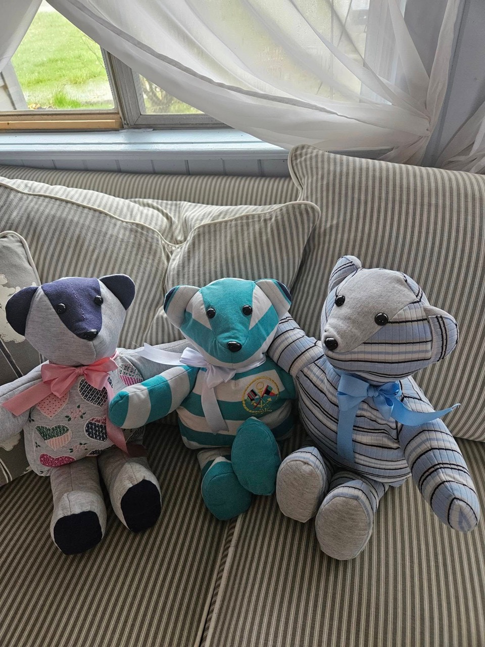 Three memory keepsake bears sewn from a child's clothing and quilt fabric